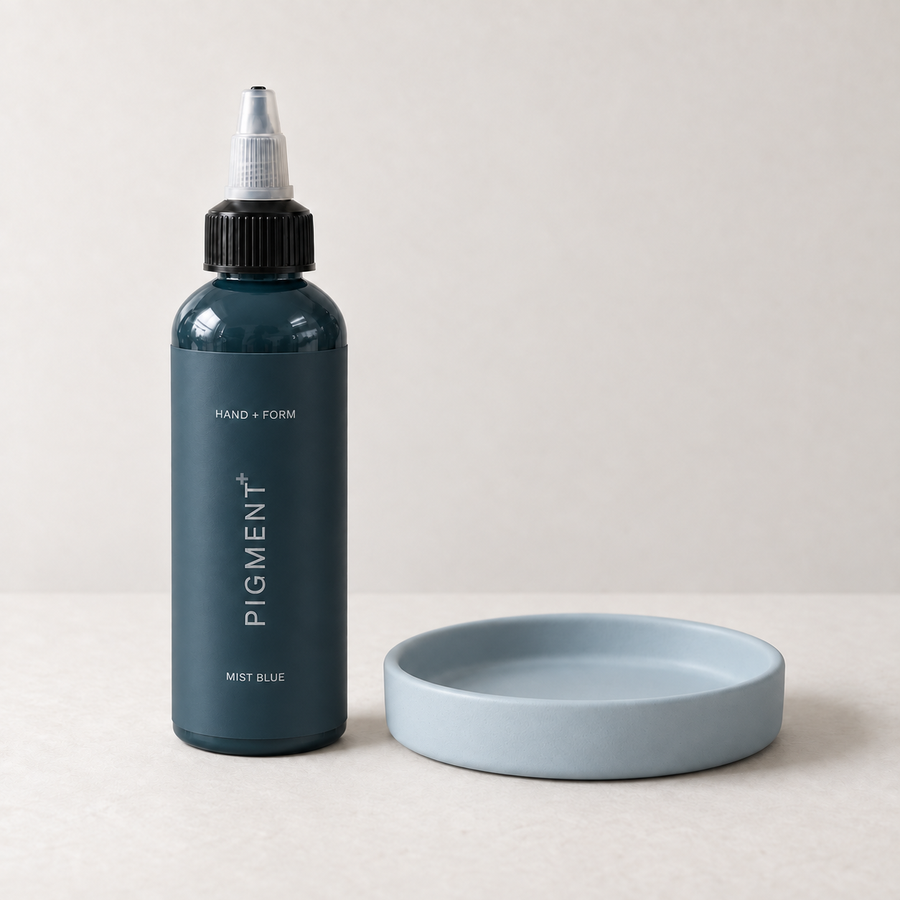 Pigment+ Mist Blue — bottle and pastel cast dish