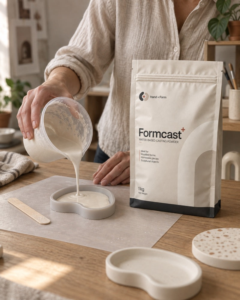 Pouring FormCast+ into a silicone mould at a kitchen table